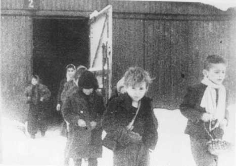 Child survivors leaving Auschwitz barracks January 1945